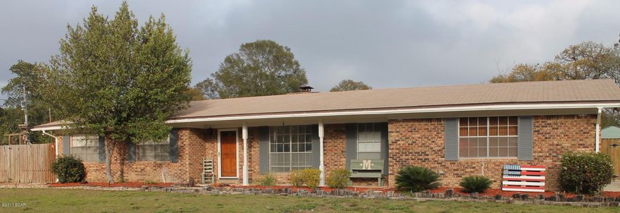 Adorable all brick home nestled in a quiet neighborhood close to downtown, shopping, Tyndall Air Force Base and much more.  This home features a large back yard with plenty of room to play, entertain, garden, as well as a detached storage shed and covered parking area for boats or other vehicles.  Three bedrooms and two and a half bathrooms as well as a large living area, large dining room and special bonus room that can be used for an office, play room or additional entertaining area.  The very spacious dining room features custom built shelving and a large fireplace. An extra bonus on the property is a very mature and producing orange tree!  With an inviting front porch and a view of the Bay, the sunsets at this house are amazing! Come see today! By Appointment Only