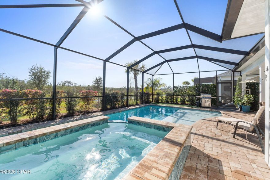 Welcome to your slice of paradise in Latitude Margaritaville Watersound. This beautiful Breeze Bay model in highly sought-after Phase 3 blends relaxed island living with thoughtful upgrades and stunning outdoor views. Ideally located close to the Town Square and amenities, this home is just a short golf cart ride to all the fun, music, dining, and fitness opportunities that make the Margaritaville lifestyle so special. Step inside to a bright, open living space highlighted by architectural ceiling beams and a cozy fireplace, creating a warm yet stylish gathering area perfect for entertaining or relaxing after a day in the Florida sunshine. The chef-inspired kitchen features a gas range, oven and microwave, ideal for hosting friends and family, while a true showstopper awaits in the stunning Mother of Pearl half bath that adds a touch of coastal elegance and luxury your guests will remember. The primary suite is designed as a private retreat with direct access to the lanai and pool area through its own private door, making it easy to step outside and enjoy the Florida lifestyle anytime. The spa-like primary bath offers a zero-entry shower, custom backlit mirror with integrated medicine cabinet, and an additional linen tower for extra storage.
Step outside and fall in love with the saltwater pool and spa, complete with a large tanning shelf, the perfect place to lounge while taking in the peaceful preserve and pond views. Grab a refreshing drink and soak in the pool or spa as relaxation truly awaits. Additional highlights include a laundry room sink, washer and dryer with extended warranty, epoxy-coated garage floor, and a Club Car golf cart with new batteries, springs, and shocks included. Designed for easy living and entertaining, this thoughtfully upgraded home blends modern finishes with the carefree spirit that makes life in Margaritaville so special.
Life in Latitude Margaritaville Watersound revolves around the vibrant Town Square, the heart of the community where neighbors gather, music fills the air, and every day feels like a celebration. At its center is the stunning Paradise Pool, a resort-style oasis with sparkling waters, shady tiki huts, and plenty of space to relax while visiting with neighbors. Residents enjoy an unmatched amenity lineup, including an indoor lap pool, a state-of-the-art fitness center, spa services, pickle ball, tennis and basketball courts, miles of walking and golf-cart trails, a kayak launch, and lush green spaces. Entertainment thrives at the Last Mango Theater, while creative spaces like the 'Clayground' pottery studio and woodworking shop offer opportunities to learn, create, and connect. Even four-legged family members are pampered with an on-site pet groomer and the popular Barkaritaville Dog Park. Live music, outdoor activities and a lively monthly farmer's market bring island energy right to your doorstep, and best of all, no yard maintenance.  That means more time to relax and enjoy the good life. Just outside the neighborhood, convenience continues with a new Publix grocery store currently breaking ground, additional retail coming soon, a future marina under development, and a new hospital being built nearby for easy access to top-tier medical care.  The future hospital, being developed in cooperation with Florida State University and Tallahassee Memorial Health Care is slated to open in 2027 and will bring first-class healthcare to the area. In Margaritaville, everything you need-fun, relaxation, convenience, and community is right at your fingertips. With shopping, dining, and entertainment just moments away, this home offers the perfect blend of luxury, convenience, and island inspired living, just bring your flip-flops!
Come experience the fun, community spirit, and resort-style living that make Latitude Margaritaville Watersound one of the most exciting places to call home on the Florida Gulf Coast. 🌴🍹
***All furniture inside/out is negotiable except piano.