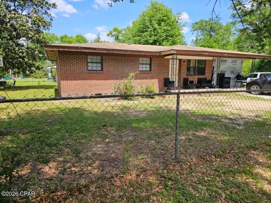 Brick home with great potential: a 4-bedroom, 2-bath residence on a corner, fenced lot inside the city limits. Currently a rental and in need of some TLC, this property offers solid bones and a chance to create instant equity for the right buyer--whether you're an investor or an owner-occupant ready to customize your next home. City utilities are in place with public water and sewer, simplifying maintenance and planning.  Some photos are virtually staged.