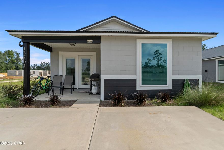 Welcome to your dream home! This newly constructed gem is a true blend of modern elegance and low-maintenance living. Located in a peaceful area just North of Panama City, with easy access to Hwy 231 and Hwy 20, this property offers the best of both worlds.

Key Features:

Construction: Concrete block construction ensures durability and peace of mind.
Roof: A sleek metal roof adds a contemporary touch and offers long-lasting protection.
Layout: The open concept living area creates a spacious and inviting atmosphere.
Flooring: Stylish finished concrete floors add sophistication and are effortless to maintain.
Kitchen: The new kitchen appliances, Formica countertops, and breakfast bar make this space both functional and aesthetically pleasing.
Outdoor Space: Relax and enjoy the covered front porch, a perfect spot to unwind and take in the surrounding beauty.
Utilities: A new septic system, concrete driveway, private well water, and energy-efficient windows and HVAC system enhance convenience and efficiency.
HOA: No Homeowners Association (HOA) means the freedom to customize your property to your liking.
Location: Situated in a serene area North of Panama City, with an easy 30-minute drive to Panama City and 40 minutes to Panama City Beach.