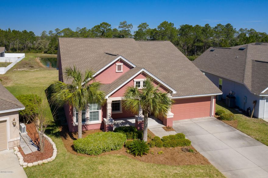 Energy Saver Certified Energy Efficient Home- Immaculately Maintained 1 Owner waterfront Home located on a large lot in the prestigious Palmetto Trace subdivision. This 3 bedroom 2.5 bath home is a must see, the large lot is unlike any others available on the beach. From the living room, enjoy the view of the Bass & Blue Gill stocked pond that feeds into a natural spring. The Interior features 10ft ceilings, an open split floor plan with office/bonus room, Spacious Gourmet Kitchen, Breakfast Area, Coffee/Wine Bar Buttler's Pantry nook  Formal Dining Room & Living room. The Kitchen Comes Complete with All appliances, including built in oven & microwave & Flat counter top range. 42' Solid wood cabinetry, tile backsplash, granite countertops, breakfast bar & Eat-in Kitchen Dining Area There is a 1/2 bath located conveniently off the kitchen with easy access to the back porch. The Master Suite is spacious with Master Bath featuring a double vanity sink, deep soaking tub, separate tile shower with glass door, linen closet, private potty area & huge Master Closet. The additional 2 bedrooms are spacious & there is a Full Bath with tile Tub/Shower combo. The home has a 2 car garage with attic storage above, Automatic Irrigation Sprinkler system & current Transferable Termite Bond & some furniture can convey with sale, please contact Realtor for details. The subdivision has 2 community pools & pet walking areas. Don't miss out on this home!Make your Appointment Today!*Measurements Approximate Please Verify if needed*