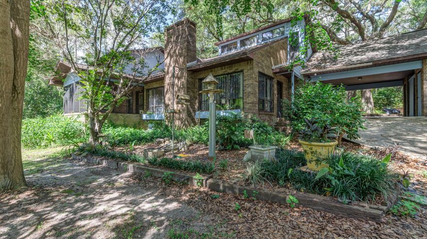 Beautiful, Big Bang For The Buck! This large 4 Bedroom 3 1/2 Bath Waterfront Home, sits on 1.19 Beautiful Shady Acres! Inside the 2,887 Heated and Cooled Sq.Ft. home, you will find Hardwood and Tile Flooring, Vaulted Ceilings with a loft overlooking the large living room with Fireplace, large bedrooms, and one massive family room. The property features multiple outbuildings, a beautiful gazebo overlooking the water, and a picturesque setting. If you are looking for a roomy, and quaint setting, this home checks the boxes. Schedule your showing today!