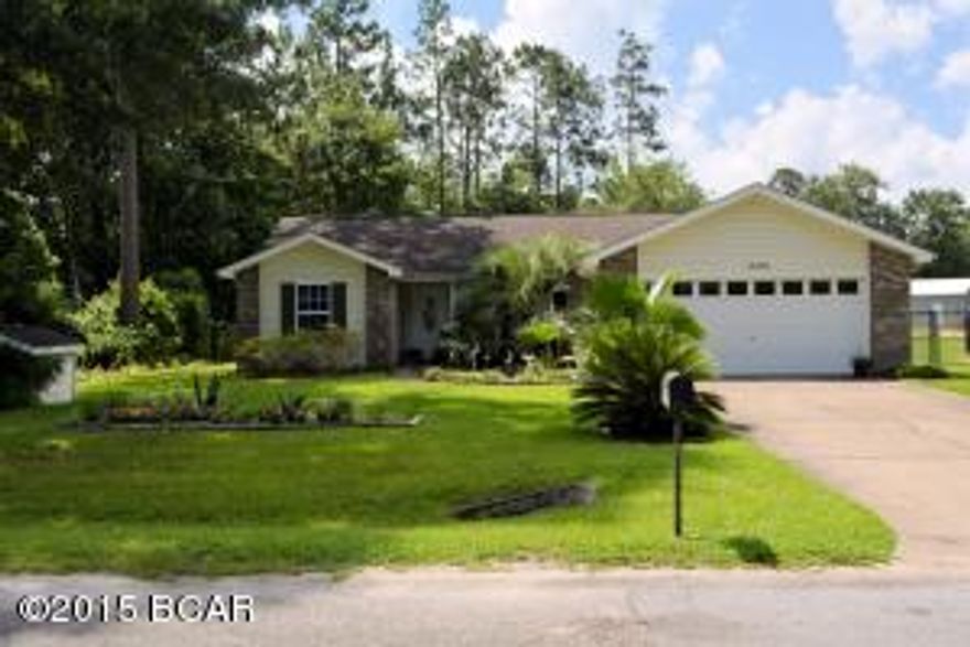 Looking for a quiet home in the country but not to far from the city.  Then look at this beautiful home on Sunshine Drive.   This is nicely landscaped with lots of palms and bedding plants for your enjoyment.  Once inside you'll find a well laid out split bedroom plan with a spacious living room. To the right of the foyer area is space designated as the formal dining area.  You'll love the spacious galley style kitchen with its' breakfast bar and lookout into the living room.  You'll also like the adjoining breakfast room.  One exceptional feature is the large Florida room addition featuring tile flooring and windows galore.  This great room addition is also adjoined by a covered patio.  The master bedroom with attached bath ensuite offers room for king size furniture.