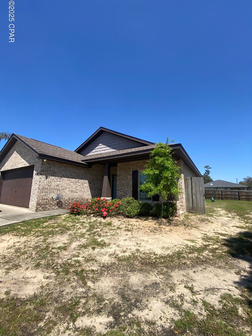 SELLER OFFERING $5,000 FLOORING CREDIT. Welcome to your dream home in a prime location—just a short walk from the highly rated Southport Elementary School! This meticulously maintained 3-bedroom, 2-bath home offers a perfect blend of comfort, style, and convenience for families or anyone looking to settle into a move-in-ready home with thoughtful upgrades throughout.

From the moment you walk in, you'll notice the elegant architectural touches that set this home apart. The spacious living area features soaring tray ceilings with beautiful crown molding, creating a sophisticated yet cozy atmosphere ideal for relaxing or entertaining. The master bedroom also boasts a tray ceiling, adding to the luxurious feel of your private retreat.

The heart of the home is the open-concept kitchen, designed for both functionality and style. Enjoy rich wood cabinetry, sparkling granite countertops, a long bar top perfect for casual meals or hosting guests, and a full suite of modern Whirlpool appliances. Whether you're preparing a quiet dinner or entertaining a crowd, this kitchen delivers on every level.

The master suite is a true sanctuary with a large walk-in closet and a spa-like en-suite bathroom featuring granite countertops, dual sinks, and ample storage. The split floor plan ensures privacy, with two additional bedrooms and a second full bathroom offering space for family, guests, or even a home office.

Major mechanical updates have already been taken care of for you—both the hot water heater and HVAC system were replaced just last year, providing peace of mind and energy efficiency for years to come. Step outside to enjoy a fully irrigated yard that stays lush with ease, and a 2-car garage that offers plenty of room for vehicles, tools, or storage.

This home checks all the boxes—modern updates, stylish finishes, a great layout, and an unbeatable location close to schools, parks, shopping, and dining. Don't miss your chance to make this beautiful property your forever home. Schedule your private tour today!