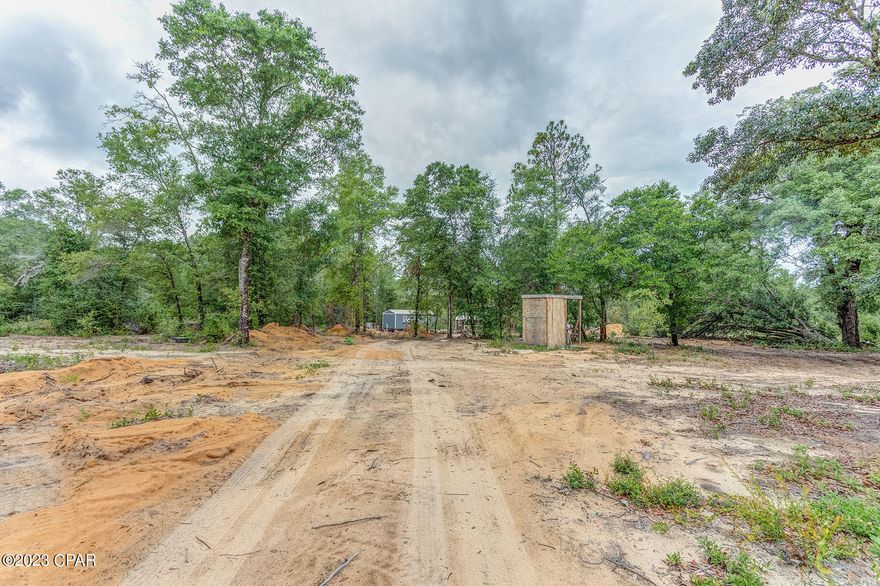 Assumable 0% Interest Loan! Land and Home package is available! Remarkable 10-acre piece of improved land that offers endless possibilities for your dream project. This serene location has undergone significant improvements to ensure functionality and appeal. Notable improvements include a well for a reliable water supply, a professionally cut-in driveway with gate-ready access, and an additional secondary driveway for increased convenience. Electricity has been brought onto the land through an aerial line, complemented by a dedicated 250' underground supply line leading to a secondary power pole. The property features several cleared and bush hogged areas, providing a clean and welcoming environment without sacrificing privacy. The owner has also added delightful flowers and fruit trees, enhancing the natural beauty. A standout feature is the dug 30x15 fire pit, reaching a depth of 10 feet. It's worth noting that a charming tiny home and storage shed currently occupy the site but will not be included in the sale (but are available for additional purchase), allowing you the freedom to customize the land to your liking. Don't miss out on this extraordinary opportunity to own improved vacant land with essential infrastructure already in place. Explore the possibilities firsthand by reaching out today!