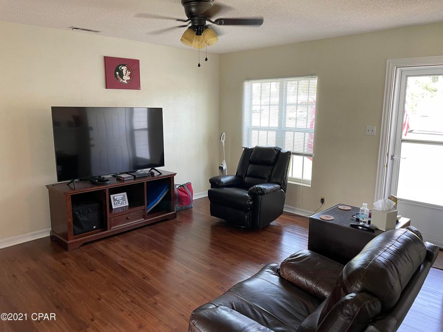 Located in a great neighborhood, quiet and little traffic. 3BR/2B, newly painted inside and out, , new double pane windows, new standing seam metal roof, new laminate wood flooring throughout most of the home and carpet in the bedrooms, electric hotwater heater replaced a couple of years ago. Everything looks great and ready to move in.