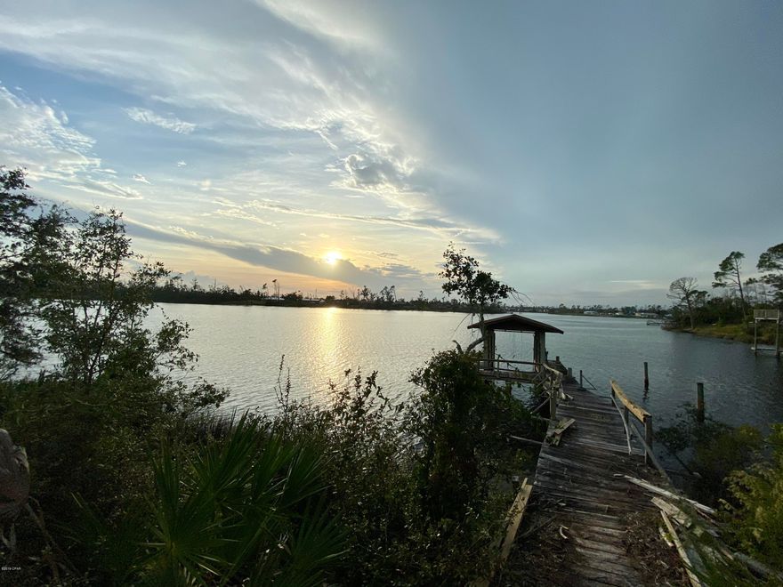 **CURRENTLY UNDER CONTRACT, SELLER ACCEPTING BACKUP OFFERS!**

WOW! Come see this breathtaking custom waterfront home! This home has been extremely well taken care of, as it has had a single owner in its lifetime of 40 years. The home weathered the storm very well and repairs have been made. This family built it from the ground up using only people they knew and trusted. It is now ready for a new family to love and care for it!

The features of this home are almost too many to count! On over a half-acre, well-manicured lot, there's plenty of room for kids and dogs to play, a pool to be installed, or anything else you can think of. It's located on an elevated, deep-water channel with a repaired boat house. Spend your evenings overlooking the sunset on the water from your porch, which is insulated and ready to be enclosed if desired!The large master bedroom has a separate patio that overlooks the water and has two walk-in closets plus a separate linen closet. Enjoy water views from one of the other bedrooms, and the living room, dining room, and kitchen.
One of the bedrooms has lots of built-in storage, great for an office, home library, or bedroom for a book-lover!
With vaulted ceilings in the living area, a floor receptacle, and a fireplace, there's nothing the living room is missing! It can entertain even the largest of families.
House includes coat AND linen closets! All appliances convey in sale.
The kitchen is a dream! Featuring plenty of counter space, real wood cabinets, an island, and space for a double oven, it has everything you could need! Separate, LARGE pantry and additional storage perfect for families.
Tucked behind the kitchen you'll find a spacious laundry room and basin - a tough find these days! Plus, a BONUS room previously used as a workshop - in other words, a perfect man cave conveniently located next to the THREE car garage. Garage has lots of built-in storage as well.
The AC and the 2 water heaters were replaced in 2014 and were not damaged from the storm. All the carpet and flooring were replaced with new carpet and life-proof vinyl plank flooring, new toilets in bathrooms, the walls have fresh paint, and any spots from removed wallpaper will be painted prior to closing. Garage doors will be replaced as well. Roof replaced this year, 2019.
No need to worry about water and sewer bills, either, as it is on private well and septic!
Plenty of parking in long driveway and 3 car garage. Room to park an RV if needed.
No neighbors on either side as they are both vacant lots - tons of privacy!
Call your agent today and come see this magnificent home! There's nothing quite like it!