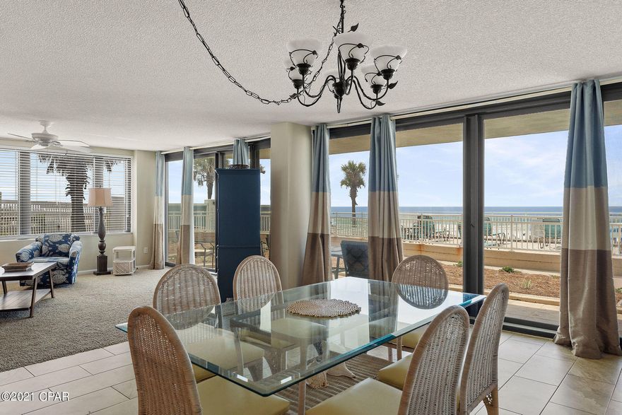 CURRENTLY UNDER CONTRACT, SELLER ACCEPTING BACKUP OFFERSWelcome to your New 2 bed/2 bath Beach Condo directly on the Gulf of Mexico! This Panama City Beach condo is an excellent opportunity for anyone looking for a personal beach retreat or a vacation rental property. This unit is on the ground floor, just steps away from the community pool and the Gulf of Mexico, no stairs or long elevator lines.  Enjoy breathtaking views of the pool and the Gulf of Mexico from the main living areas, kitchen, and primary bedroom suite. You'll love this condo's open floor plan, tile floors throughout, and granite countertops in the updated kitchen and both updated bathrooms. The Gulf Front Primary Bedroom suite also has patio access, and the primary bathroom suite has a double sink vanity. This condo is in East end of Panama City Beach, and the amenities include a Gulf front seasonally heated pool, shuffleboard, tennis and racquetball courts. New gulf front windows & sliding glass doors and the complex is beautiful. Call today to see this beach condo in person!