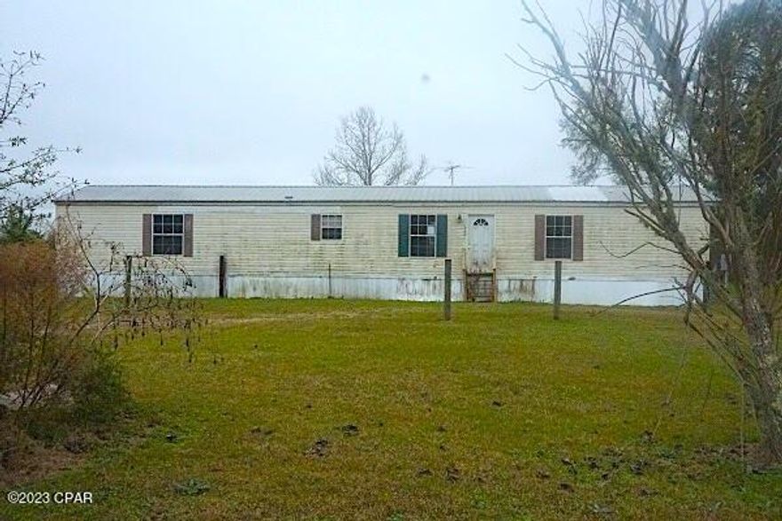 Well maintained singlewide on 2 acres on a paved road with a split floor plan, Master bath with soaking tub, separate shower and double sinks, lots of room for animals and to let the kids run around, within minutes of Chipley.  Don't miss out on this one call today. Owner Occupant offers to be viewed beginning on 1/16/23 at midnight. (All info is approx, buyer to verify any and all important info.)