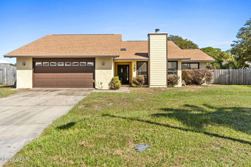 Don't miss this Grand Lagoon Shores pool home! This 2016 remodeled home features 3 bedrooms, 2 bathrooms, wood burning fireplace, new paint, new cabinets, granite countertops, newer appliances, kitchen island, and Florida room. The home is on a large lot with an inviting pool, outdoor patio and a fantastic 2 car detached garage with double garage doors.  This could be a great workshop or mechanics dream! The roof was replaced in 2021 on the house and detached garage.  The water heater was replaced in 2022 as well.  The in-ground salt filtered pool was resurfaced in 2018 and the pump was replaced in 2023. The yard is fully fenced for privacy.  The home is  located on a quiet cul de sac and is just minutes from the beach, shopping and restaurants.  Come take a look at all this home has to offer!