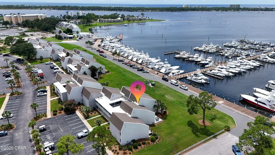 Imagine ending each day with the glow of a fiery sunset reflecting off the water, yachts gently swaying in the marina, and the quiet hum of coastal life all around you. This ground-floor Harbour Villa in Bay Point offers exactly that and so much more.

Set within one of Panama City Beach's most sought-after gated communities, this golf cart-friendly neighborhood is a hub of activity and relaxation. Tee off on Bay Point Golf Course, enjoy fresh seafood at nearby restaurants, listen to live music at Bar 72, take in a day of boating, or enjoy the competition on the Bay Point Tennis Courts. Everything you love about coastal living is right here at your fingertips.

Inside, this villa has been beautifully remodeled with tile flooring throughout for easy living, an updated kitchen and baths, and an electric fireplace for those cozy evenings in. With two full bathrooms and a sunroom just off the living area, you'll have the perfect mix of comfort and functionality. The sunroom offers a quiet spot for morning coffee or a front-row seat to watch the marina activity unfold.

Whether you're searching for a vacation getaway or a year-round retreat, this Harbour Villa pairs resort-style amenities with the charm and serenity of a true waterfront haven. Here, the sunsets aren't just beautiful they're unforgettable.