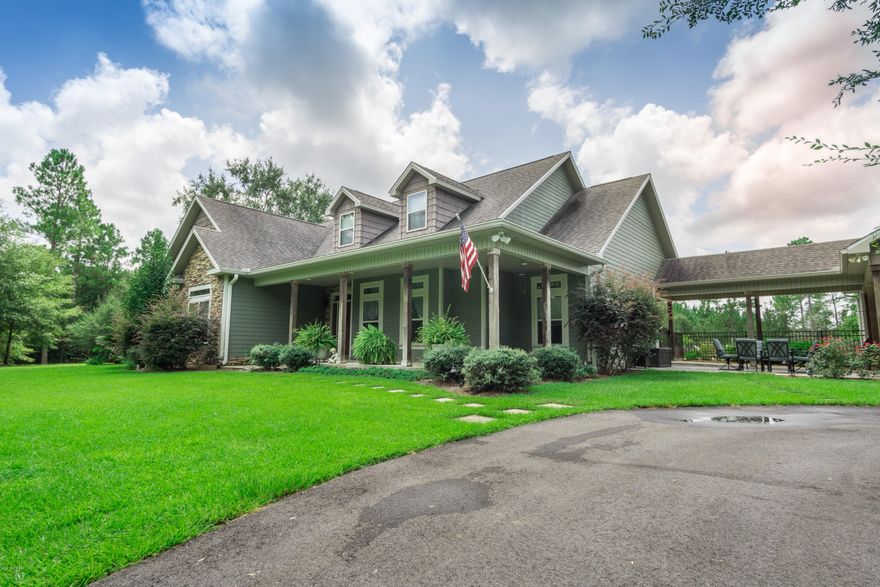 ABSOLUTELY STUNNING contemporary and secluded home! Located in the beautiful lush countryside down a long winding paved driveway...but only 4 miles to shopping, restaurants, and medical facilities. Over 10.5 acres of breathtaking views all around this spectacular property. If the saltwater pool with brick pavered patio, waterfall, and sun deck don't win you over, the amazing finished and air-conditioned ''barn'' with lean-to, or the upstairs 59x19 master suite will (There is a 2nd master suite downstairs)! The updated kitchen features granite countertops, an eat-in island, brand new GE stainless steel black slate appliances (gas stove, dishwasher, microwave and refrigerator), pot filler, and breakfast nook with Tiffany lighting. Crown molding throughout and living room has gorgeous double tray ceiling and inset lighting. The entire upstairs is an unbelievable master suite with a 16x18 Hollywood style walk-in closet with smaller closet inside, huge walk-in shower with 2 shower heads, a galley style area with a bar, cabinets, refrigerator, microwave, and double vanity. Downstairs is an additional master suite that opens to the pool area and has a jetted garden tub. All downstairs bedrooms have tray ceilings, large closets and all full baths have double vanities. Additional features include 2 NEW central heat pump a/c units, central vacuum system, covered porches and whole house sound system, security system, separate dining room with modern light fixtures, grilling area with gas line connection and lounging area, underground dog fence, mod landscape lighting, timed irrigation system, water filtration system, workshop/storage attached to carport, and storage everywhere inside and out. Within 50 miles to the crystal clear water and sandy white beaches of Panama City Beach and NW FL Beaches International Airport. Bonus: Abuts 2 ponds and a lake.