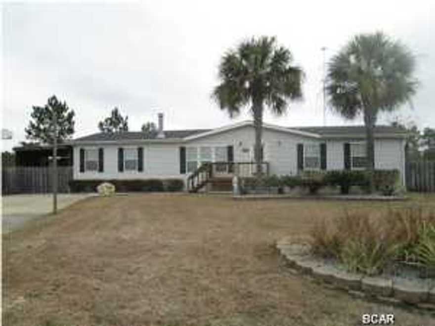 WATERFRONT!! Extremely nice modular home in Sweetwater Village. This home has been well cared for and offers many extras that you will not find anywhere else. From the huge living room and kitchen to the large bedrooms, the home shouts spaciousness throughout. There is so much storage space and every bedroom has a walk in closet. The Master Bedroom closet is large enough to call it a small room. The Master Bath has separate shower, tub and double vanities. There is also a 16 x 20 workshop that is really used as a music room with extra insulation, heat, air conditioning, vaulted ceiling and finished throughout----also a perfect man cave. The carport is large enough to hold a boat and a car and has a gate across the front that completely swings out for easy entry/exit as well as a