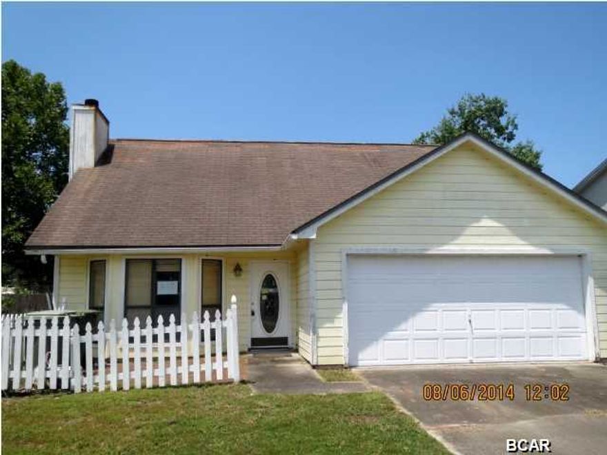 ATTRACTIVE TWO-STORY HOME IN LYNN HAVEN! The home features a large living room with a fireplace, cathedral ceiling, full kitchen, half bath and parquet floors throughout the first floor. The Master bedroom is on the first floor and has an updated Master bath and hall laundry closet. The second floor has two bedrooms and a full bath. This home needs some interior and exterior repairs, but it has loads of potential. This one is perfect for a renovation loan!