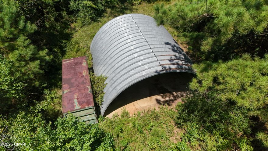 REDUCED TO $289,999!!  Beautiful parcel of land located in country setting with elevation up to 200 feet. Property is wooded. Has Interstate 10 frontage on one side. There is a sturdy quonset hut style metal barn with a concrete floor. There is electric right of way on property and a transformer near which would make it more affordable to run an electric line to property.  There is a well on the property but its condition is unknown. Well was previously ran by generator. According to map, there is no wetlands on property which is rare. Whether you are looking for a home site or a place to get away from it all, this parcel has many possibilities.