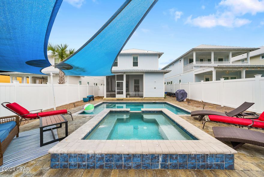 Boasting nearly $150,000 in gross rental income in 2023, with owner usage - tracking for 2024 - make sure you ask about rental!

View this vacation rental 4-bedroom, 3 1/2-bath pool home tucked away less than a block from the pristine beaches of Panama City Beach.  3 years of consistent rentals with documents upon request. This property offers a perfect blend of investment potential and personal enjoyment.

Property highlights include a private heated saltwater pool, spillover jacuzzi, and a sun shaded lounging area. Spanning 2,277 sq ft, this charming residence is situated at the West end of Panama City Beach. Conveniently situated between the shopping and entertainment of Pier Park, and the fine dining and boutiques of scenic Hwy 30a. The location, with the beach access in sight from the driveway, ensures convenience without compromising on serenity. The interior, bathed in natural light, features a spacious and open floor plan adorned with high-end finishes.

High-impact hurricane-rated doors and windows, luxury vinyl plank flooring, high ceilings, Plantation shutters, and stringless blinds. The kitchen, boasts quartz countertops, a double wide stainless sink, beautiful tile backsplash, and stainless appliances, including a gas cooktop stove. 

The first-level Master suite, one of two in the home, showcases a tray ceiling, dual sink vanity, frameless walk-in tiled shower, and a spacious closet. Ascend the staircase to discover a landing adorned with kids games and a Trundle daybed, opening onto a covered porch, perfect for relishing the refreshing Gulf breezes.

The second Master suite on the 2nd floor continues the theme of luxury, featuring a tray ceiling, Plantation shutters, and an ensuite bath with dual sinks, a walk-in tiled shower, and a generously sized walk-in closet. Two additional bedrooms, one with a king bed and the other with full top and bottom double bunks, share beautifully appointed baths.

This like-new residence harmonizes elegance with functionality, offering a dual-zone AC system, tankless gas, and thoughtful design elements throughout. Whether you seek a lucrative investment or a dreamy coastal retreat, this property beckons you to explore the unparalleled lifestyle it affords. Schedule a viewing today!