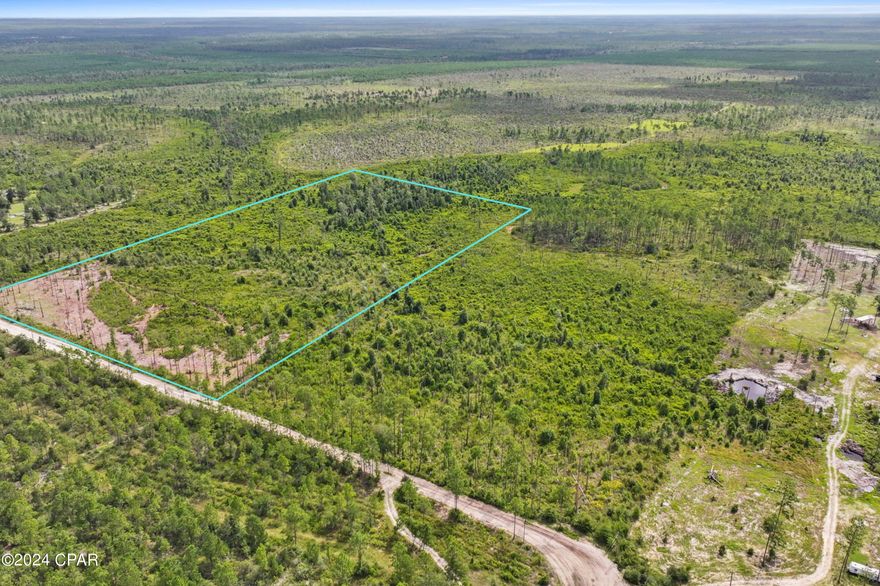 Owner financing available! Discover this tranquil, unrestricted 20-acre parcel just a couple of miles off Highway 231. Located in a quiet country setting, this land is perfect for those seeking peace and privacy. The property is accessed via a private road, about half a mile beyond the county-maintained section, ensuring seclusion.

According to the GIS map and the seller, there is a freshwater creek running along the back of the property, giving it a valuable resource, perfect for a homestead. There is also an abundance of wildlife in and around the property. Approximately two acres at the front have been cleared and mulched, offering a great start to the development. There are no utilities on the property yet, but power poles are running down the street in front of the property. 

Zoned AG-1, Bay County regulations allow for one dwelling per 10 acres. The property is in a flood zone, typical for areas near water bodies, but this only enhances its natural appeal.

Whether you're looking for a serene escape or a potential agricultural venture, this 20-acre parcel offers a lot of possibilities. Cash only. 

Buyer to verify specific usability of the land with the appropriate official departments and Bay County Planning & Zoning. 

Owner financing available with $30k down up to 5-year term.