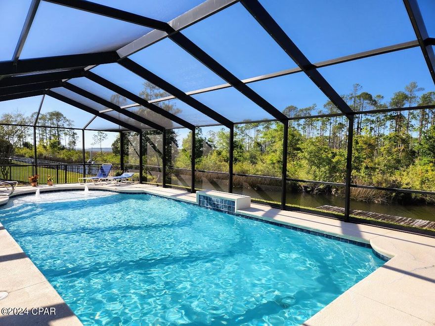 'CURRENTLY UNDER CONTRACT, SELLER WILL CONSIDER BACKUP OFFERS' . Bring your water toys! Amazing remodeled brick waterfront home with an inground saltwater pool featuring a sun pad and enclosed lanai is waiting for you!  All new vinyl floors and paint throughout, 2023 kitchen appliances, oversized walk-in shower in the master bathroom, central vacuum, metal roof and much more! The home has three (split) bedrooms, two baths, family room, den/bonus, dining room and climate controlled sunroom which offers so much flexibility. Plus the canal has access to St. Andrews Bay so bring your watercraft that will accommodate a 22' to 25' boat. This home has the convenience of local shopping and doctors, yet the private feel of nature. It's a must see! Age, Sq.Ft., dimensions, or any important information to the buyer must be verified via a personal or professional inspection.