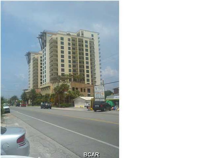 Low unit, on rental program managed BY EMERALD VIEW - front desk...close to East elevator which is close to parking garage underneath NOTE: dimensions of living/dining/kitchen/bedroom are obviously all the same ROOM in an efficiency and please do NOTE the floor plan is attached below pictures...measurements are approximations only -- one of best constructed condos in PCB, built by R.J. Griffin from Atlanta...condo is close to the action of the beach, i.e. Sharky's immediately across the street, Pier Park, Gulf World, many other restaurants and shops. REMEMBER, EAST SIDE enjoys cool afternoons on shaded balcony -- NOT the blazing sun from the WEST; and you get all sunrise views, plus the lovely lights of the city at night...