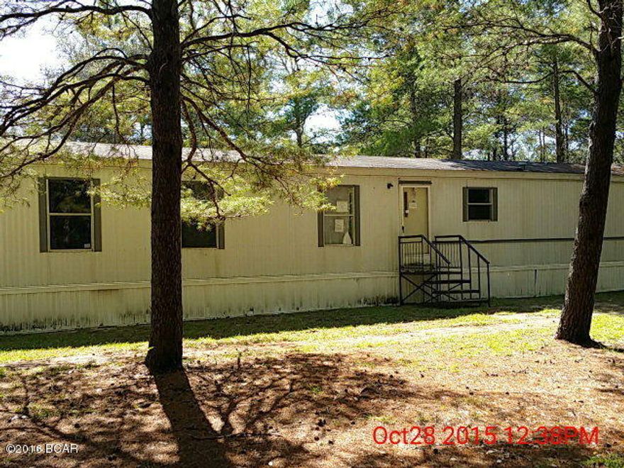 Single-wide mobile home in move-in condition, split bedrooms, and open kitchen with refrigerator and stove. Sits on 2.39 acres with paved frontage on Rock Hill Road. Large open deck on the back of home and nice, large yard with plenty of room to roam.