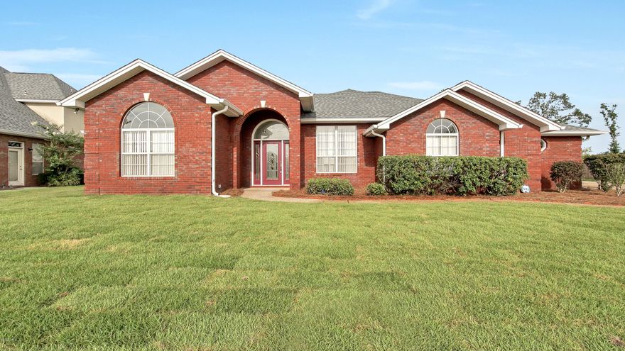 This beautiful brick home is situated on over a half acre lot - the largest in Huntington Ridge. Almost everything in this home is brand new to include the 

custom cabinets and black stainless appliances in the kitchen. The large master bedroom has an en suite with double vanities, a separate soaker tub and new tiled walk-in shower. There are 3 additional spacious bedrooms, 2 of them on the other wing of the home. The tiled bedroom connects to the 2nd bathroom, which has double vanities and lots of storage. This home also features a freshly sodded front yard with irrigation, privacy fence, several mature citrus trees, tank-less water heater, new blinds throughout, new AC, new roof, and an enclosed porch that can easily be converted in to a heated/cooled space! Lots of storage and parking in the 3 car garage and over sized driveway. Huntington Ridge is a beautiful community in Lynn Haven with no HOA and flood zone X! You're not going to want to miss this one!