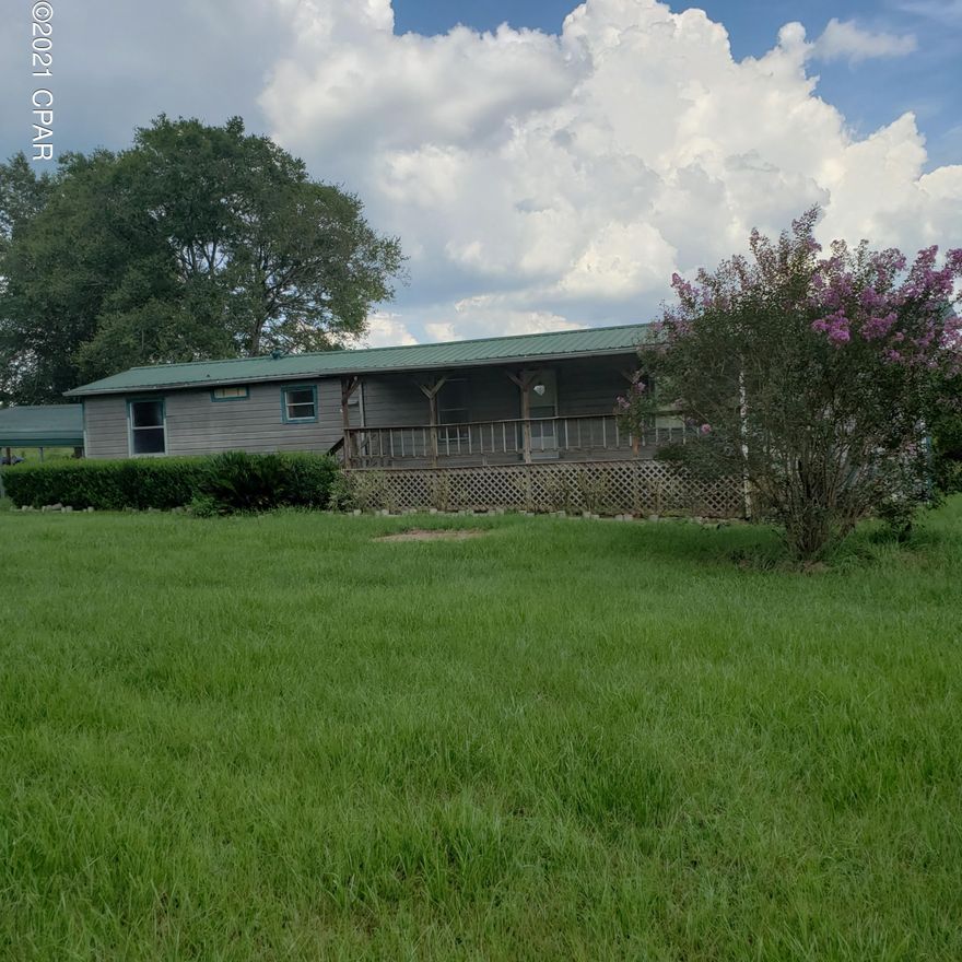 Great  horse ranch. 4 bedroom 2 bath single wide mobile home with addition on 12 acres. Home needs a good cleaning and some TLC. Home has pine lap siding and a metal roof. Large covered front and back porches. 2 car carport.  Huge 78X36 horse barn with tack room.  Metal Hay barn that is 36X24. Old block building that needs work.  Pole barn.  Land is mostly pasture with some woods.  Pasture is grown up and in need of mowing.  Only cash offers or owner financing with 30% down.  With a little maintenance and fixing up this a great place to call home.Being Sold ''AS IS'' .