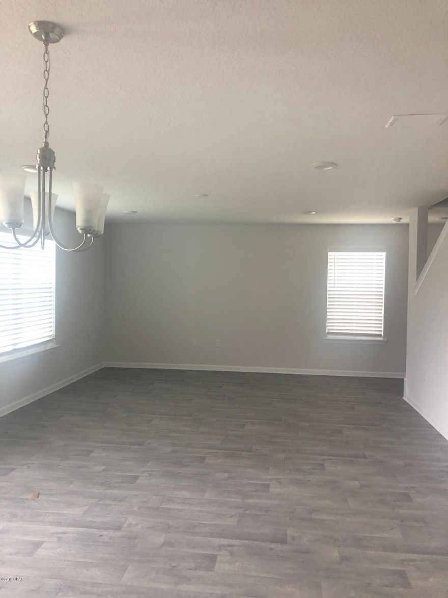 Four bedroom, two and a half bath home. This home has a large great room downstairs that is open to the kitchen that has a center island with walk-in pantry. There's an office or study just off the foyer. This two story home built in 2019 and is located in the new subdivision of Bridge Harbor. This neighborhood is only 5 miles from the Tyndall Air Force Base .



Upstairs has master bedroom with large walk-in closet and master bath with double sink vanity, separate shower and garden tub. Three additional bedrooms share a hall bath.Community pool. Two car garage