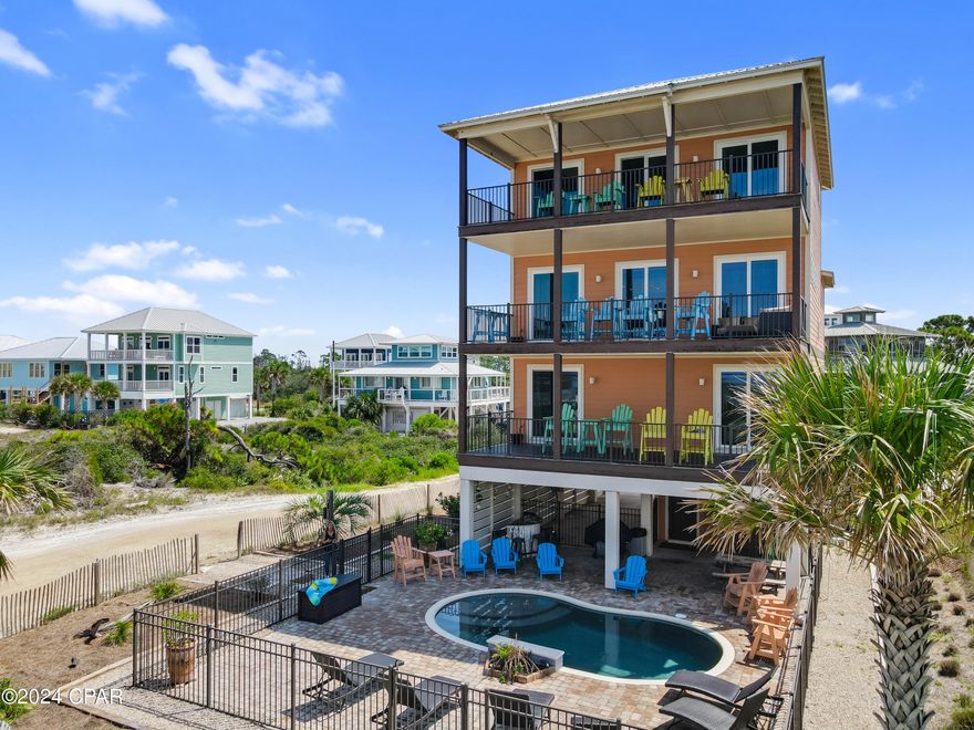 Welcome to your coastal paradise on the coveted North Cape! This remarkable 5-bedroom home offers almost 6,000 sq ft of living space, providing an abundance of room for both indoor & outdoor living. As you step inside, you'll be captivated by the exceptional design & attention to detail. Wide Gulf-view decks offer the perfect space to soak in the breathtaking views & enjoy the fresh sea breeze. The gorgeous private pool invites you to take a refreshing dip, while the Gulf-view fire pit creates a relaxing space for gatherings with family & friends. For those who love sports & outdoor fun, a private volleyball court adds to the coastal living experience. The master suite, situated on the entire top floor, is a true retreat with awe-inspiring Gulf views. Wake up to the beauty of the ocean, & enjoy the convenience of a coffee station and refrigerator right in your suite. The luxurious master bath features a soaking tub, separate shower, & a private deck, providing a serene space to unwind and enjoy the beauty of the surroundings. This home offers two living areas, ensuring plenty of room for relaxation & entertainment. The kitchen is a chef's dream with stainless steel appliances, including a stand-alone ice maker, & stunning granite countertops. The dining area can accommodate up to 10 guests, with extra seating available at the island, making it ideal for hosting memorable gatherings. With 4 full baths & 2 half baths, there is no shortage of convenience for you & your guests. A private reading nook offers a tranquil space to escape with a good book & immerse yourself in quiet relaxation. Ample storage is available for all your beach toys & essentials, ensuring that everything is neatly organized & within reach. Best of all, the home is situated just 50 steps away from the boardwalk, providing direct access to the beautiful Gulf. Rest easy knowing that this property is located in an X Flood Zone. This coastal retreat is a dream come true!