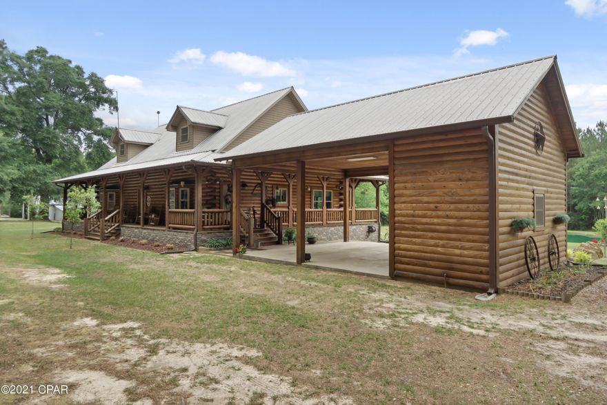 Southern charm meets a custom-built log cabin! The wow factor is in full force as you drive down the winding driveway and are greeted with this stunning 2,400+ square foot white pine home containing 3 bedrooms and 3 ½ baths. The main level of the home features a spacious living room with 25 ft cathedral ceilings, wood burning stone fireplace, stranded bamboo floors, a chef's dream kitchen boasting granite countertops, breakfast bar and stainless-steel appliances. The luxurious master suite is complete with his/her closets, double vanities, soaking tub, custom walk-in shower and private access to the wrap around porch. Upstairs you will find a loft overlooking the living room and 2 guest rooms each with full ensuite baths. Step outside and enjoy a cup of coffee from the wrap around porch, riding 4 wheelers, fishing from your very own pond stocked with catfish and bream or tinkering in the barn. Property is secluded on 20+/- acres just off SR-81