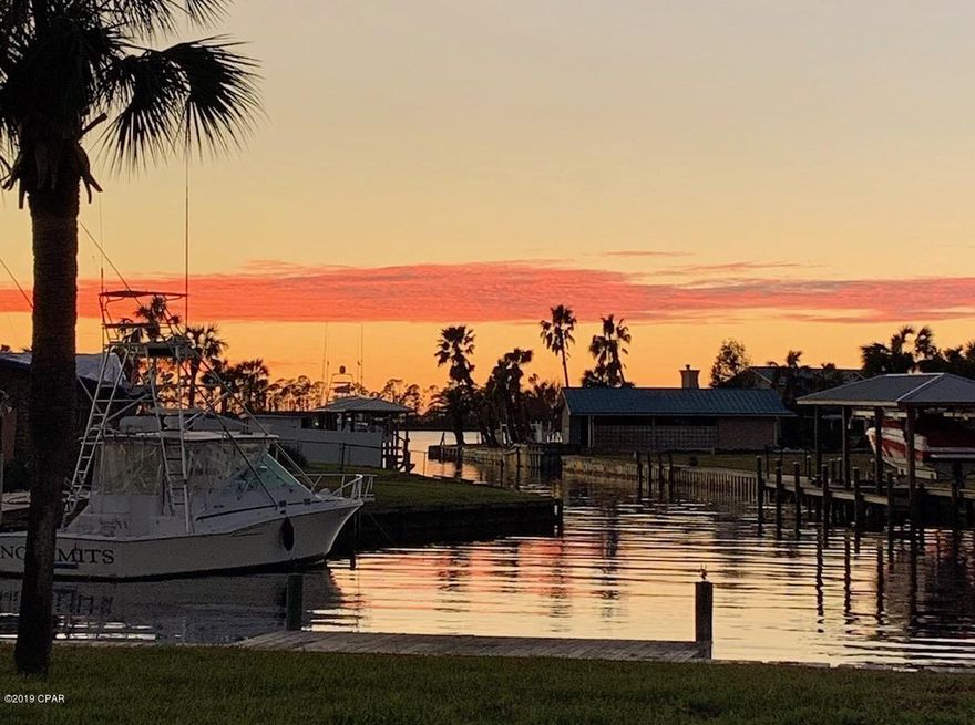 Rare waterfront opportunity in Lynn Haven's desirable Northshore! Updated 3 BR + Bonus / 4th BR plus Florida Room! The open plan home is amazing, and the home site is truly one of a kind with over 350' of saltwater frontage and nearly 360 degree water views! Boathouse with hoist, in-ground pool, outdoor shower, additional dock and large patio to enjoy amazing sunsets. Deepwater with plenty of draft for larger boats and an easy ride to the Gulf. The private waterfront master retreat has separate patio access, a large walk-in closet and beautiful tile shower in the bath. Vaulted ceilings in the family area showcase a double-sided brick fireplace. Wood-look tile throughout offers durability and peace of mind for years to come. Don't m