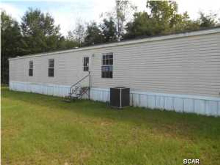 1 acre lot in a great location to Marianna and all amenities, master bathroom with double vanities, garden tub plus a separate shower, master bedroom walk in closet and kitchen/dining combo, with an open living room area. (All info provided is approximate, therefore Buyer to verify ANY info that is important.)