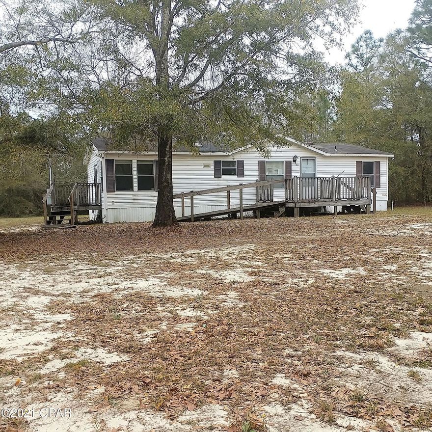 Great location on a paved road and convenient to all that DeFuniak Springs, Florida has to offer.  Large living room with wood-burning fireplace.  Split-bedroom floor plan with a nice-sized master suite.   Kitchen comes with refrigerator, stove, dishwasher and range hood.  There is a shed in the back yard and plenty of room in the back yard for a garden or a pool.