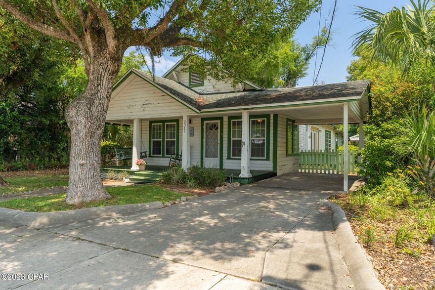 CURRENTLY UNDER CONTRACT, SELLER WILL CONSIDER BACKUP OFFERS. Welcome to the Scott/Yerby House.  Are you ready to unlock the full potential of a historic Florida home? This rare opportunity awaits you and this property has all the makings of something truly special. This one-of-a-kind home boasts a rich history, with beautiful architecture and unique features. This property is located in the historic waterfront community of Millville with its unique character, rich history, and alluring charm, make this home one of a kind. Original pine wood hardwood flooring throughout. Many updates in the main house circa 2007 include an updated kitchen with stainless steel appliances. The primary house is a 1472 sqft,  3 bedroom, 1 bathroom. Nestled behind the primary house is a precious 444 sqft 1 bedroom, 1 bathroom carriage house -perfect for a rental on the property OR use as a hobby shed, a multi-purpose space, a home office, a workshop, or as additional storage space- the possibilities are endless. Two additional yard buildings offer a perfect location for a shop and storage for tools or recreational vehicles. Landscaping has mature oaks and flowering trees surrounding the property and fencing makes this the perfect setting for a garden. Floor plans for both the main house and carriage house are in the photos. Watson Bayou with a public boat launch on N Church St. just around the corner/ walking distance from this gorgeous home. Tyndall Air Force Base is a convenient drive, only 15 minutes (7.6 miles) from this home. Imagine waking up each morning in a home that has stood the test of time. Motivated Seller! Bring all offers!