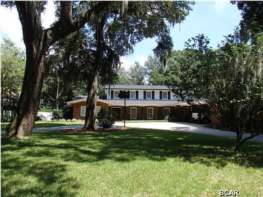 Beautiful Cove waterfront home on Hollis Avenue. Breathtaking century old oak trees surround the home and in ground pool. This view does not disappoint and gives you the feeling of an old plantation. Home has a boat dock, two boat lifts and a separate boat house. Property is located on deep water with direct access to St. Andrews Bay. This a large home at approximately 5700 sq.ft. with 5 bedrooms, 4 full bathrooms and 3 half bathrooms. There is plenty of room for a large family both inside and out, all in a great neighborhood on a safe and quiet street. Make an appointment to see this spectacular home today.