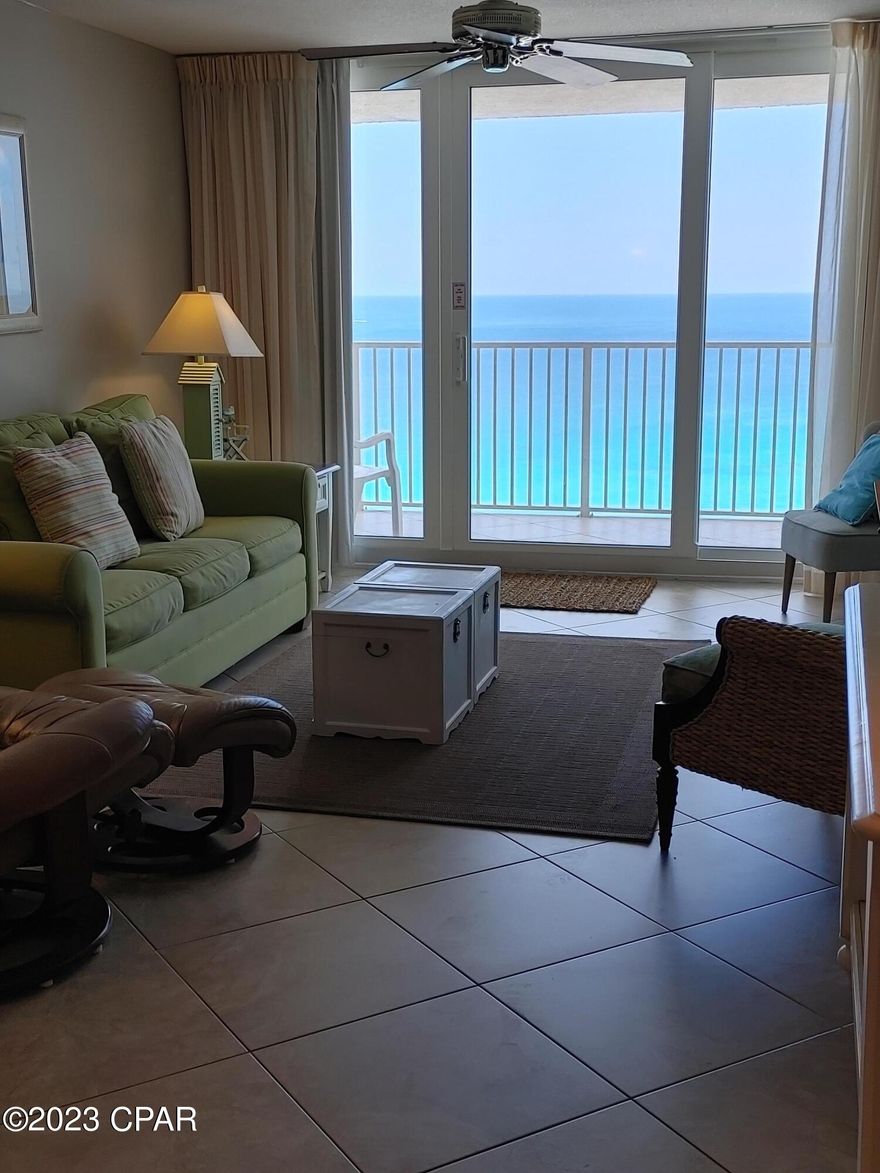 Dunes of Panama E2105 - Fabulous Gulf Views from the living room, kitchen and master suite. Beautifully remodeled and updated. This is a top floor condo. Tiled throughout with 20''x20'' tile, set on the diagonal, including the bathrooms and balcony. Own your piece of paradise as a second home or an investment property. The Dunes of Panama Resort has 1500 linear feet of sugar white sand, 3 Pools, Tennis Courts, Basketball, Free Wi-Fi, Fitness Room, Volleyball, Shuffleboard, Outdoor BBQ Grills