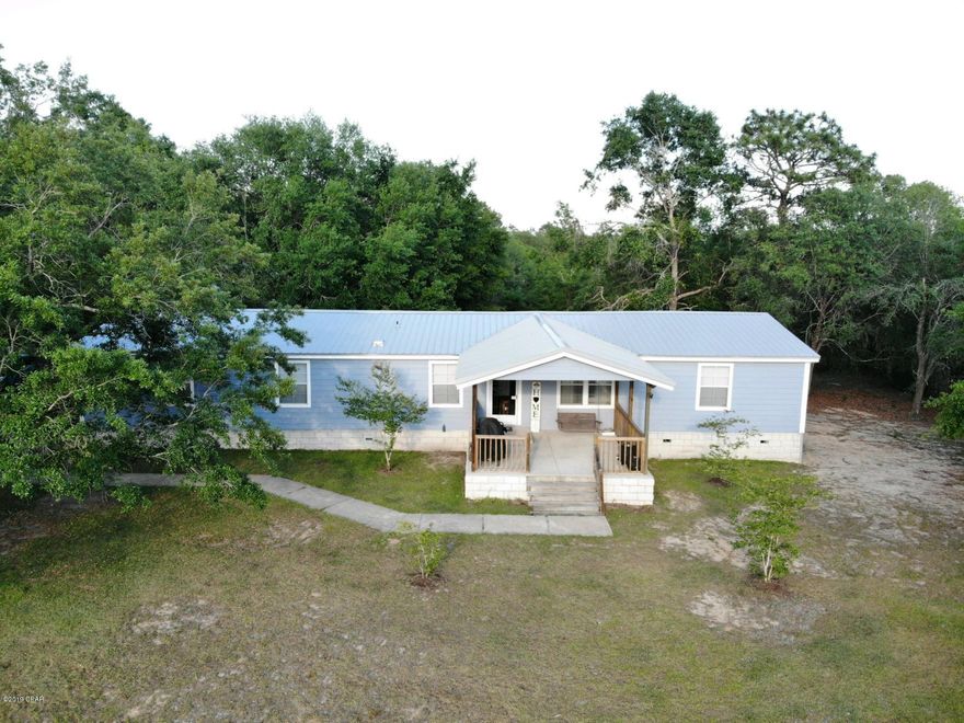 This one has it all! 4 bedrooms and 3 FULL bathrooms on 1 fenced in acre!  New AC (2017), new metal roof(8/2018) and new Hardie siding just installed. Inside you will find numerous upgrades, huge master bath with garden tub, walk in closet, and double vanity.  Eat in kitchen with an island and additional dining space.  Two living rooms, one with a wood burning fireplace!  Two additional bedrooms with a jack-and-jill bathroom.  Fourth bedroom has a walk in closet and designated bathroom.  There is also a large laundry room and bonus room used as an office.

Outside, you will find a huge 24x36 pole barn ready to house your RV or boat, surrounded by mature oak trees.