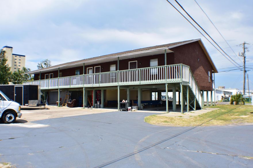 Apartment building two blocks from the beach and just a few blocks from a public boat ramp on Grand Lagoon!   This is a 5-unit complex; each unit is 1BR/1BA and approx 940 sqft. The roof is new, sheet rock repaired and new appliances are in process of being installed.  Two units received new HVAC units.   Each unit rents for $1350 per month.  Great investment property in Gulf Lagoon Beach!   All info is approx. and must be verified by BUYERS if important.