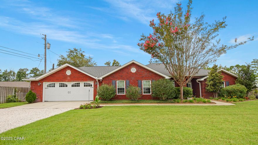 Welcome to waterfront living on almost an acre lot with no HOA fees! This 3 bedroom/2 bathroom brick home PLUS a large Bonus Room has been updated and lovingly maintained. The living room is warm and inviting with real hard wood oak floors and a gorgeous wood burning fireplace. The living room opens to the dining room and eat-in kitchen, perfect for entertaining. Warm cabinetry and stunning new quartz countertops offer plenty of storage and workspace for preparing meals and enjoying friends and family. The large bonus room provides loads of flex space for an additional living area, kids play room, man-cave or office. The master bedroom is spacious with a gorgeously renovated bathroom complete with tile walk in shower and garden tub. The homesite overlooks Mill Bayou where you can launch your canoe, kayak or paddleboard from your private dock. New roof in 2019, completely renovated bathrooms, new air conditioner in 2021, and a whole house generator are a just a few of the stunning upgrades. This home boasts a perfect location as well! Conveniently located on a quiet enclave on a newly paved private road while being  just 5 minutes from grocery stores and less than 15 minutes from the heart of Panama City shopping or new and improved downtown Panama City. A large dog park is also steps away! Make an appointment today to see this spectacular home!