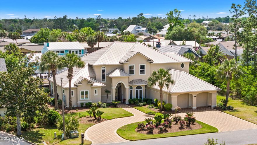 Open House this Sunday (4/19) from 1pm to 3pm. New to the Market! Come discover this luxury waterfront retreat in North Harbour. Designed for both modern living and entertaining. Perfectly positioned with 90 ft on the canal with direct water access to the Gulf of America. This elegant residence offers the ideal blend of sophistication and coastal convenience. Step inside to an open-concept layout boasting soaring 22ft ceilings and thoughtfully curated architectural details. The main space showcases a beautiful staircase, fireplace, and plenty of windows. Bright and airy with natural light. Hardwood floors, recessed lighting, and crown molding throughout the entire home. A half bath for guests right off the main space. The kitchen is an absolute masterpiece, featuring high end finishes, custom cabinetry, and a spacious island that flows seamlessly into the main space. The perfect spot for family to gather. No expense spared with Taj Mahal countertops, a Wolf 48'' range, pot filler, and even a water heater under the sink for instant hot water. Coffee bar with separate sink. The cabinets feature plenty of custom drawers and there is also a walk-in pantry. Soft close doors and drawers. The master suite on the first floor serves as a serene escape. A spacious bedroom with direct patio access. En suite is complete with a custom tile shower, his and her vanities and walk-in closets. An amazing staircase leads you to the 2nd story with three very spacious bedrooms and a full bathroom. One of the bedrooms has been completely plumbed and wired for an additional bathroom if there was ever a desire. Also on the 2nd story is a 31x10 terrace overlooking the canal and pool, a great place to catch the breezes off the bay. Back on the first floor, two sets of French doors lead you to the enclosed and heated pool allowing for year-round enjoyment, offering a resort-style atmosphere with added privacy and protection. It becomes an expansion of the living space when entertaining. Just beyond the pool, the canal-front setting provides direct access for boating, kayaking, or fishing right from your backyard. A boat house with power/water and 10k lift. Should accommodate up to a 30ft vessel. A seawall down the entire water frontage. Not only a beauty, this home is also a fortress, featuring a standing seam metal roof, spray foamed attic, and a 22k whole home generator. An oversized and air conditioned 2-car garage that is really like a 3-car with epoxy floor coating, it feels like an additional room. 2 Tankless water heaters. Speakers throughout entire home. Manicured landscaping. Pride of ownership shows from the moment you arrive.