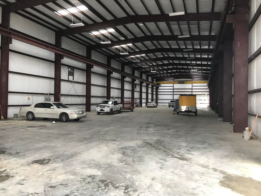 Now Selling ''AS-IS''.  The property includes a 14,700 sq. ft. building with 6.19 acres. Construction highlights include: 26' clear at the eaves, one 10-ton & one 5-ton gantry crane. Two 20'x 16' street-level doors (need to be replaced). 3-Phase-400 Amp service, air-hose lines. 8''+ reinforced concrete slab.   Zoned General Commercial (C-3A), Unincorporated Bay County. The sellers will subdivide & the adjacent buildings & land to the north and east are also available for sale or lease (6513 Bay Line Dr.-MLS#682595 / 7001 Bayou George Dr. & 6521  Bay Line Dr.-MLS#682451).