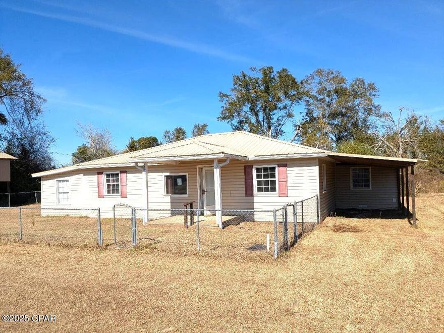 Great place in the country on paved road between Altha and Blountstown.  It has chain link  fencing , 2 out buildings and a nice large RV shed.  There are 4 bedrooms, 2 bathrooms and a large living/dinng room.  The back yard is large enough for a small garden.  With a little bit of updatng you will have a very nice place.
