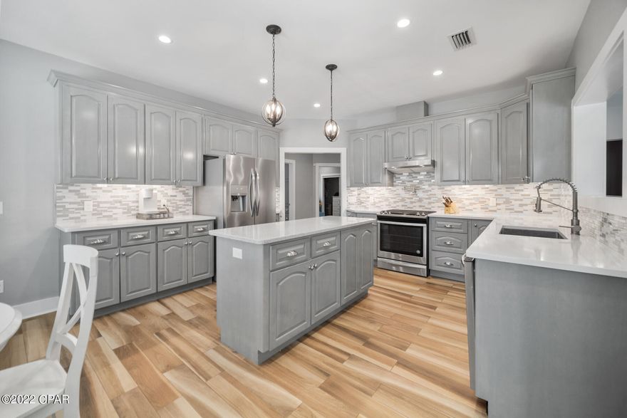 CURRENTLY UNDER CONTRACT, SELLER WILL CONSIDER BACKUP OFFERS. GREAT four bedroom, two bathroom home with over twenty three hundred square feet located in the desirable Cove neighborhood. This home features wood-look tile throughout the main living spaces and wet areas, carpet in the bedrooms, recessed lighting throughout, a tankless water heater, a formal dining room, and built-in bookcases in the living room. In the oversized mudroom/laundry room you'll find an abundance of storage space, access to the garage, a sink for easy clean-up, and motion-censored lighting. Out of the four bedrooms, three of them feature walk-in closets! The primary en-suite boasts a foyer that allows for privacy, two walk-in closets, a built-in safe, access to the backyard, a double-vanity, and an awesome... oversized, and open, walk-in shower. In the kitchen you'll find beautiful cabinetry with under cabinet lighting, an attractive tile backsplash, a pot filler, and a kitchen island. This home features spray foam insulation and most walls are 2x6, including inside walls. Step out in the backyard and enjoy a covered patio with plenty of room for outdoor furniture, ceiling fans to help keep you cool, a privacy fence, and a stunning pool and hot tub. There is also a stub outside for the grill. The private pool is saltwater, heated, goes up to 6 ft deep, and is surrounded by a beautiful brick paver deck. Don't miss out on this awesome property, call today!