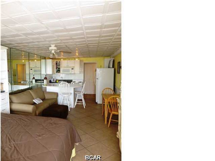 This renovated unit is one the nicest in this complex! Incredible Gulf views at an unbelievable price! Take advantage of prices now while it's still a buyers market! Completely furnished efficiency unit ready to be enjoyed by YOU! Enjoy the magnificent sunsets of the fantastic southwesterly view and the white sandy beaches! Unit has recently been completely renovated. New tile throughout, new white bead board walls, re-glazed tub, replaced entire kitchen (including cabinets, tile back splash, stove, refrigerator, microwave, track lighting) and new bedding and linens show very nicely....Unit includes all furnishings and window treatments. Complex amenities include: Olympic size indoor heated pool (with fantastic view of gulf), sundeck, BBQ grills, large conference center/social center