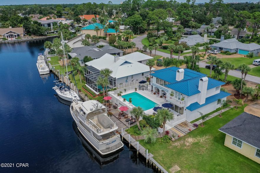 **CURRENTLY UNDER CONTRACT, SELLER ACCEPTING BACKUP OFFERS**



Beautiful updated home in very desirable gated Bay Point Community. Dock your yacht right behind your home, 85-90 feet with 50 amps. Brand new dock completed 2020. Located at East end of the bridge so there is no boat height restrictions. Located on main canal. Boat in pic does not convey, shown for visual. Salt water pool, lots of storage around pool.



Home updated in 2020 with NEW METAL ROOF, interior entirely painted, updated KITCHEN with granted counter tops. Large living room w/wet bar and fireplace!  Plantation shutters, retractable awnings. OVERSIZED GARAGE! Master bedroom has balcony, fireplace, large closest w/custom built-ins. Master, 2nd bed, bath plus exercise room or bonus room all on second level. Guest bed and bath located on first floor.