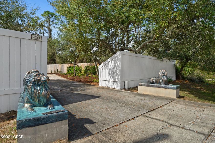 Exquisite estate home, over one acre on the Grand Lagoon. Main home offers 4 or 5 bedrooms all en-suite and an additional office suite. High ceilings, open floor plan, Venetian plaster...There is also a separate 600 SF yoga studio/gym not included in SF. Swimming pool, boat dock...