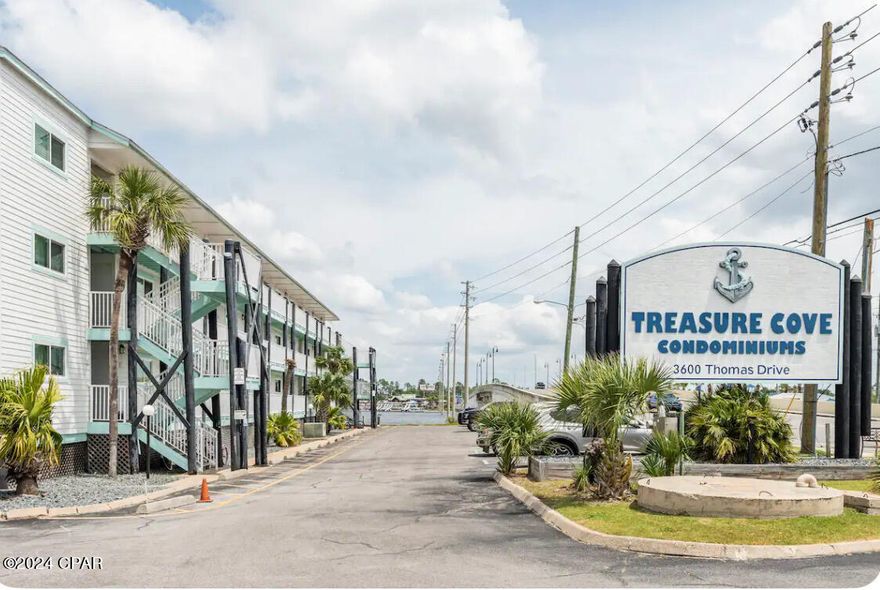 A Waterfront Gem!  
Welcome to Treasure Cove Unit 206, a stunning waterfront condo that has been completely gutted and remodeled down to the studs after the recent hurricane. This fully updated unit combines modern elegance with coastal charm, creating the perfect getaway for beach lovers and savvy investors alike. 
**Key Features:**

- **Renovated to Perfection:** Every inch of this unit has been meticulously redesigned, boasting contemporary finishes, open-concept living spaces, and abundant natural light. 

- **Great Rental Potential:** With a short-term rental, this unit offers fantastic income potential, making it a smart investment choice to help offset expenses of a 2nd home.!

- **Spacious Accommodations:** Featuring hall bunks and a sleeper sofa, the unit comfortably sleeps 5 following the new Bay County fire regulations, ensuring a cozy retreat for families or groups.

- **Amenities to Enjoy:** Take advantage of a sparkling swimming pool, convenient day-use boat dock, and designated boat parking for owners. Guests also have the option to park their boats nearby for a small fee.

- **Prime Location:** Just a leisurely 3-5 minute walk to approximately six fantastic restaurants, you'll never be far from delicious dining options. Plus, world-class water sports and entertainment surrounding you at multiple marinas right across the street on The Grand Lagoon.  
Call your favorite realtor and claim this gem as yours today.