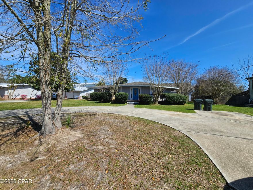 Investor special or someone wanting to make this your home. Located in a great neighborhood and area of Lynn Haven (Panama City FL) with so much potential. $ bedroom 2 bath home with a large garage in back for whatever you want to do. Close to everything this home offers a large living area with fireplace, double sliding doors to back yard and wrap around deck. Kitchen placed in the center of house and the bedrooms are split from master bedroom. Roof replaced around 2022, Hvack replaced in 2017, water heater replaced 2025. True value is the location with high home values and size of lot. Repairs needed is cosmetic. House was built a octagon but doesn't look like it but that's why a center beam in the house. This is a must see that's priced to sell. all information and measurements if important should be verified.