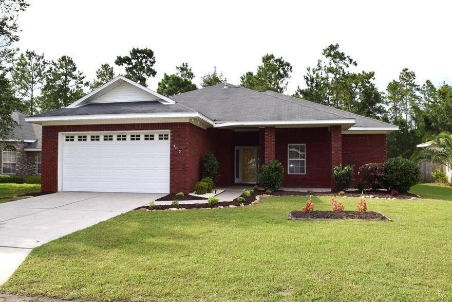 Holiday cheer shared with new price improvement! If you like privacy, you'll like this one! This beautiful brick home is on a cul de sac and backed up to woods! High ceilings and a large open floor plan make this 3 bedroom, 2 bath home very appealing. Wood floors and a gas fireplace create a beautiful living area. The bay window in the dining space adds a nice touch to this open area. Granite counter tops grace the large eat in kitchen and both bathrooms. The master bedroom is huge at 20ft by 20ft and the master bath has a jetted tub as well as a shower!  The walk in closet provides plenty of room for sharing. The other 2 bedrooms have walk in closets as well. Whether it's grilling out back in the large open porch or chilling on the large covered front porch, this home offers great outdoor opportunities to entertain and relax.