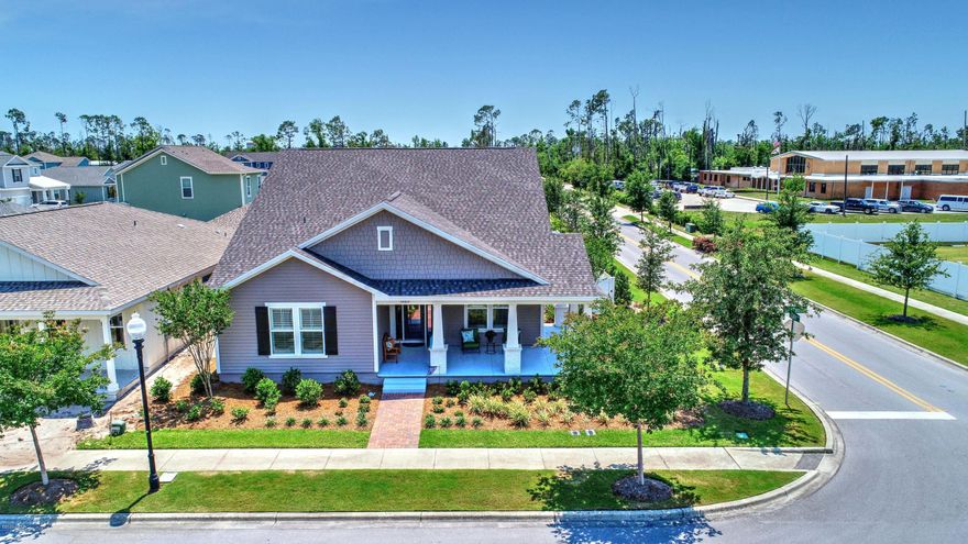 This gorgeous home had over $43,000 in upgrades when it was built along with a  lot premium of $20,000 for the corner lot facing the water feature and stage that separates it from University Academy.  Can you imagine sitting on your own 256 sq foot wrap-around porch watching the neighborhood entertainment? Sweetbay is a wonderful community in a super location with unreal plans for the future.  This elevation is called the ''BOATBUILDER'' and the plan is the MARCO II with a bonus area upstairs.

If you like pristeen, you would never know anyone has lived in this home. It is immaculate with a tankless water heater, level 5 tile on the main floor, plantation shutters in most rooms,  popular GRAY high $$ cabinets and upgraded appliances. They also added a white vinyl fenced yard. Come & see!