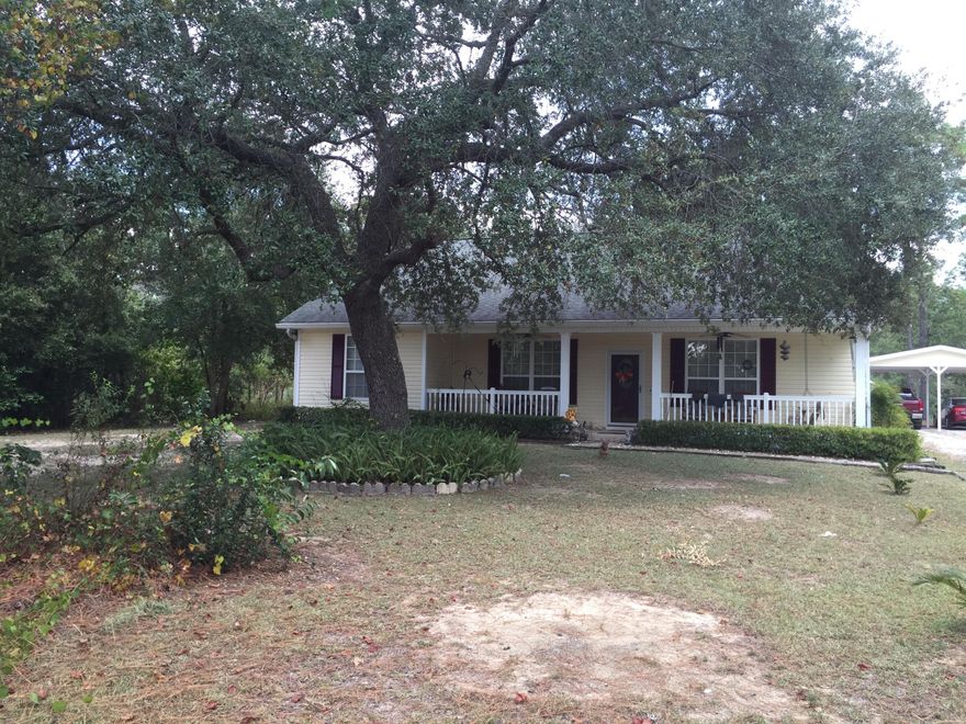 This builder's custom home has most everything desired in the gated subdivision of Leisure Lakes, just north of Panama City. It has 3 bedrooms, 2 baths, double garage, carport and a circle drive across from the big clear lake. The large kitchen features a breakfast bar and dining area to the side, just off the huge laundry room. The master suite's bath has a whirlpool tub with mounted flat screen TV, double vanities and a walk-in marble shower. New laminate hardwoods installed this summer. The living room has custom cabinetry, trey ceiling and a fireplace. Out back is a building or man cave that includes an office with fireplace and a separate workshop. Parking includes a 2-car attached garage and a 2-car carport with a covered walkway. Call for list of amenities including two big lakes.